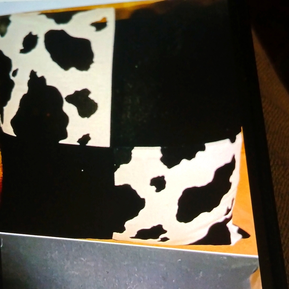 Black and White Cow Print Pillow/ zipper closing. Cover only